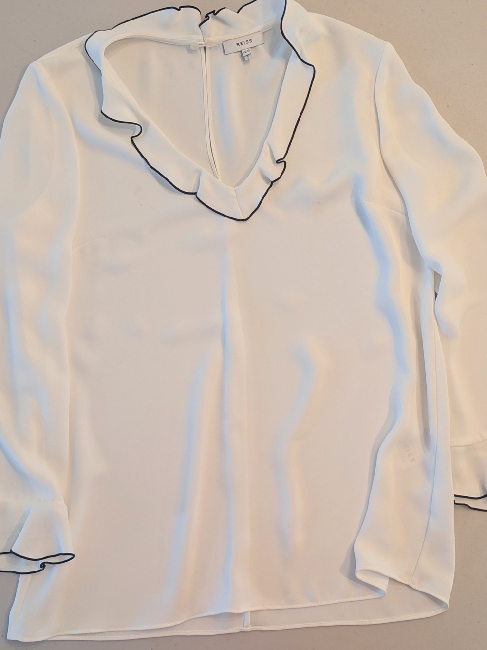 Reiss Cream Ruffle V-Neck Blouse with Black Trim